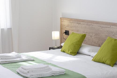 Кровать или кровати в номере Hotel Tornielli 9