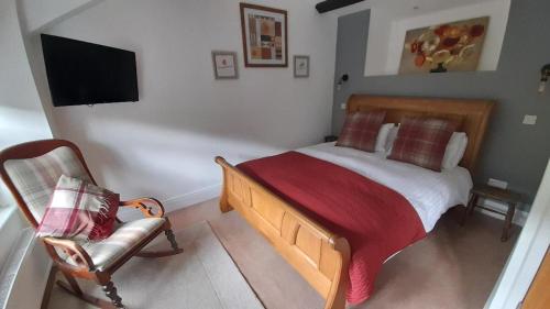 Ένα ή περισσότερα κρεβάτια σε δωμάτιο στο Ty Gwyn Hotel