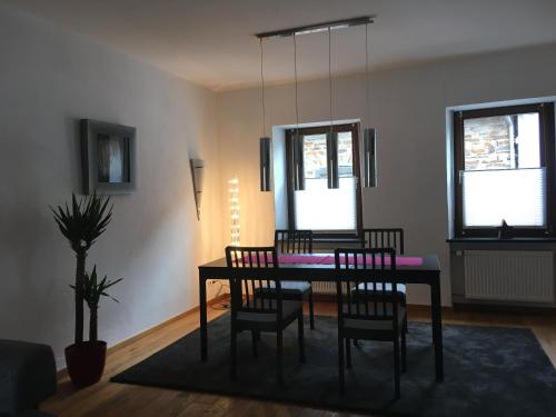 a dining room with a table and chairs at Ferienhaus Alte Scheune in Pommern