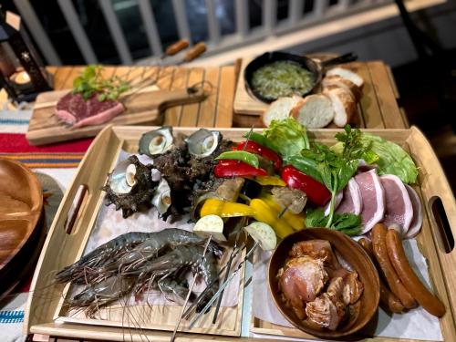 two wooden boards with different types of food on them at Hostel Have a Nice Day! ドミトリー 個室ルームあり#HVNI in Odawara