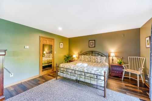 a bedroom with a bed and a desk and a chair at Sunset Beach in Glenora
