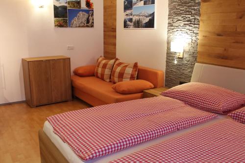 A bed or beds in a room at Hotel Sonne