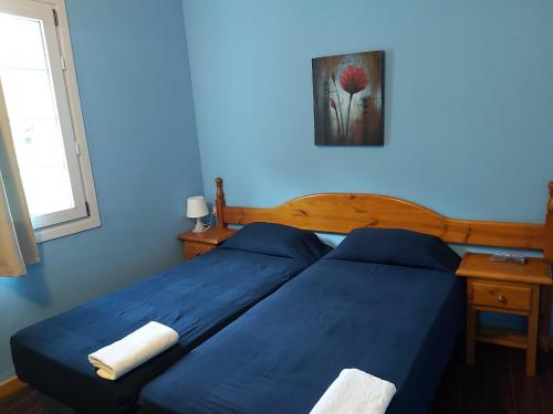 Katil atau katil-katil dalam bilik di Hostal Porta De Núria