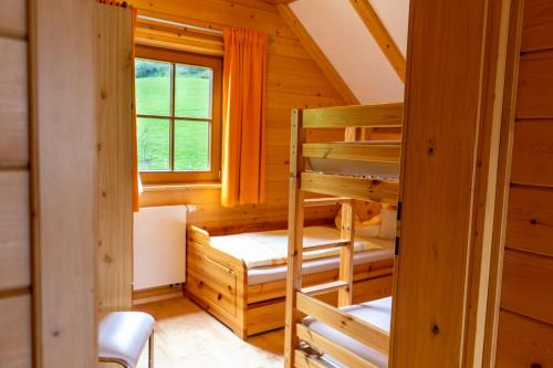 Una cama o camas en una habitación de Bergchalet am Tonimörtlhof