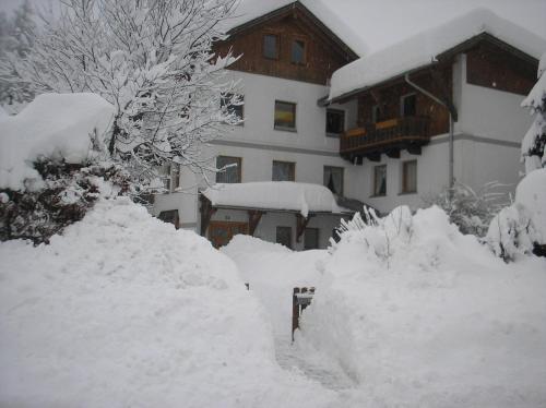 a pile of snow in front of a building at Appartements Fritz Sagmeister in Jenig