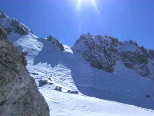 a snow covered mountain with the sun shining on it at Appartements Fritz Sagmeister in Jenig