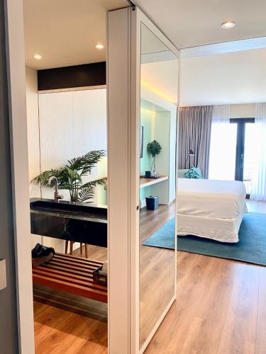 a bedroom with a bed and a sliding glass door at Holland House Beach Hotel in Philipsburg