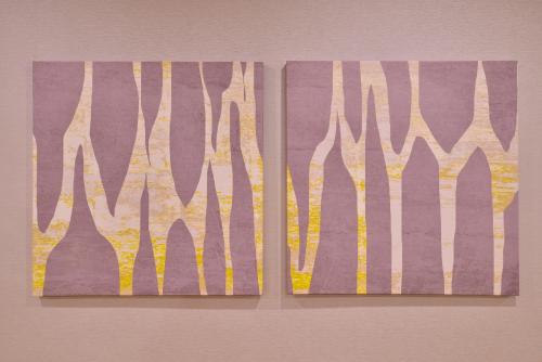 two pieces of art hanging on a wall at Holiday Inn Dallas-Richardson by IHG in Richardson