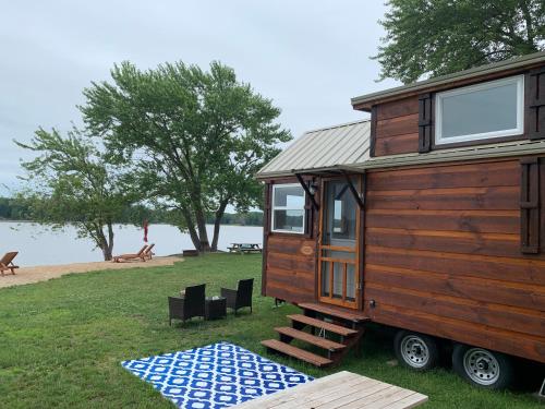 a wooden tiny house sitting on top of a rug at Riverbottom - Tiny Home 2 in Bellevue
