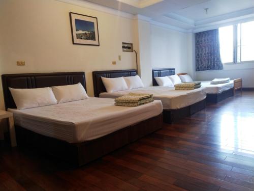 Katil atau katil-katil dalam bilik di Taitung Travel Hostel