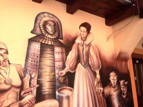 a wall painting of aaraoh and other people at Ubytovanie Anka Sučanská in Čachtice