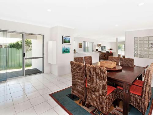 a kitchen and dining room with a table and chairs at Busselton Beach House with WiFi in Busselton