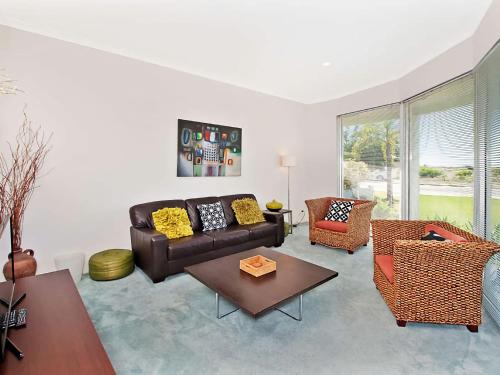 
a living room filled with furniture and a couch at Busselton Beach House in Busselton
