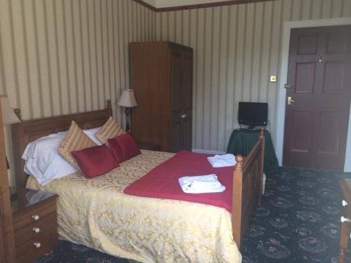 Katil atau katil-katil dalam bilik di Broom Lodge