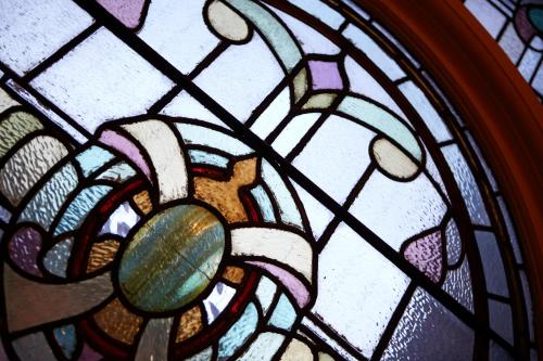 a stained glass window with a flower on it at Best Western Lichfield City Centre The George Hotel in Lichfield