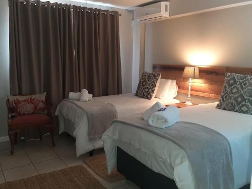 Ένα ή περισσότερα κρεβάτια σε δωμάτιο στο St George's Guest House