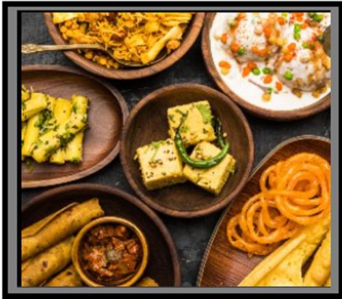 a group of plates of food on a table at Sterling Gir in Sasan Gir