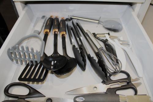 a drawer filled with lots of kitchen utensils at Didcot- Private Flat with Garden & Parking 03 in Didcot