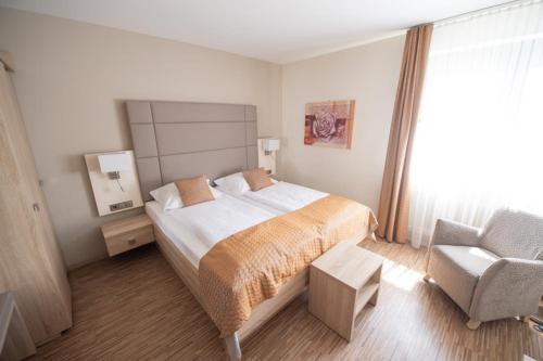 מיטה או מיטות בחדר ב-Hotel Trapp