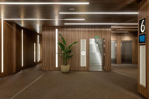a hallway with a potted plant in a building at ME Barcelona in Barcelona