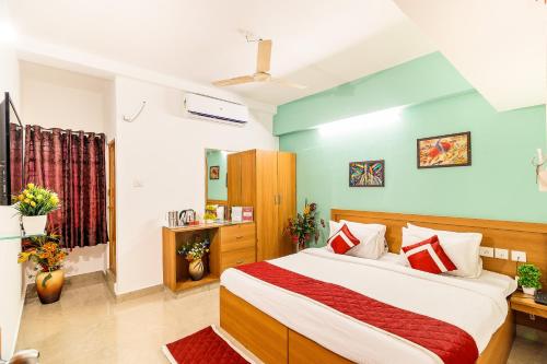 a bedroom with a large bed in a room at Octave Paris Residency in Bangalore