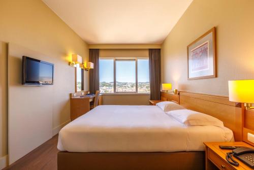Cama ou camas em um quarto em Hotel Fundador