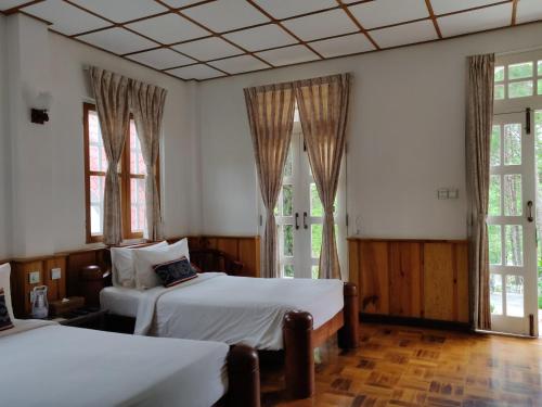 Postel nebo postele na pokoji v ubytování Hillock Villa