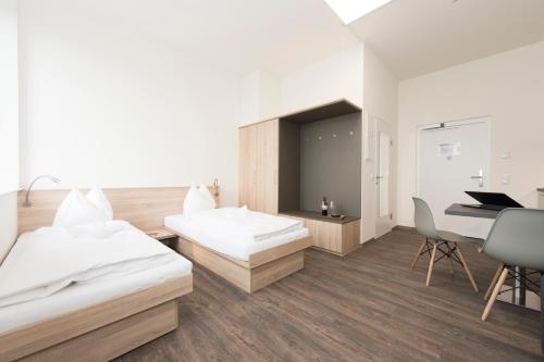 Ένα ή περισσότερα κρεβάτια σε δωμάτιο στο TT-ROOMS - kontaktlos mit Self Check-in