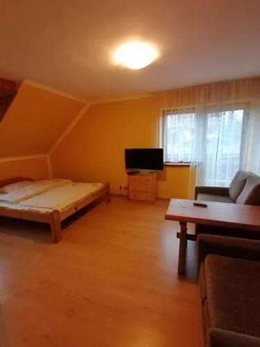 Posteľ alebo postele v izbe v ubytovaní Pokoje Gościnne Alexandra