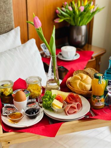 a table topped with plates of food on a table at Burghotel Nürnberg in Nürnberg
