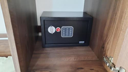 a safe in a room with a door open at Apartments Kojic in Bar