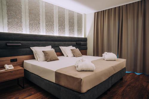
Een bed of bedden in een kamer bij Inex Olgica Hotel & SPA
