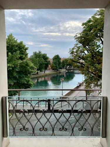 a view of a river from a balcony at Locanda Ponte Dante in Treviso