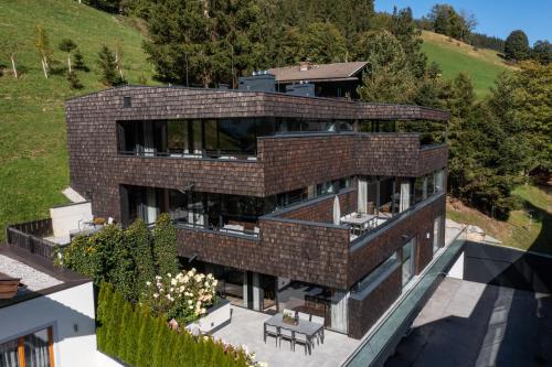 an aerial view of a brick house at Sunny Ferienwohnungen Ski In - Ski Out - Self Check-in in Zell am See
