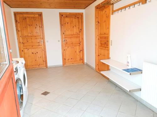 a laundry room with a washer and dryer at Skovly FerieCenter in Humble