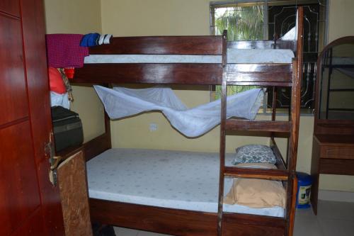 a couple of bunk beds in a room at JJ & JE Family House in Dar es Salaam