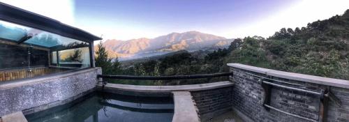 a swimming pool with a view of the mountains at Home of the Great Wall in Huairou