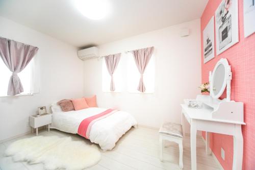 Ένα ή περισσότερα κρεβάτια σε δωμάτιο στο Shiga Lakeside Villa in Minamishinbo