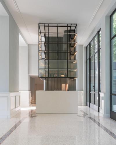 a rendering of a lobby with a chandelier at Villa Làrio Lake Como in Pognana Lario