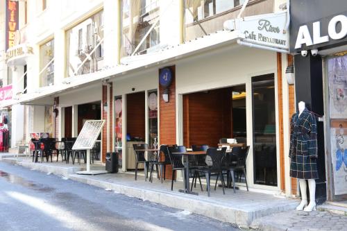 a restaurant with tables and chairs on a city street at Istanbul River Hotel in Istanbul