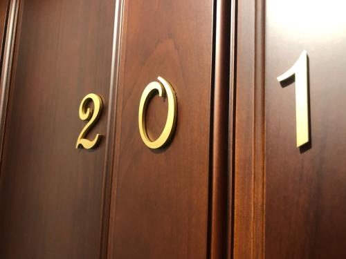 a wooden door with the number on it at Full house in Taitung City