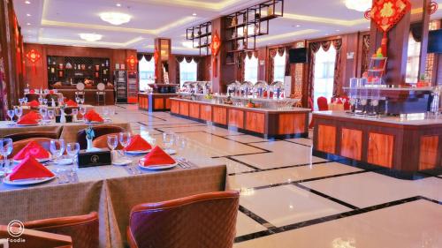 a restaurant with tables and chairs with watermelons on them at Golden Peacock Hotel Blantyre in Blantyre