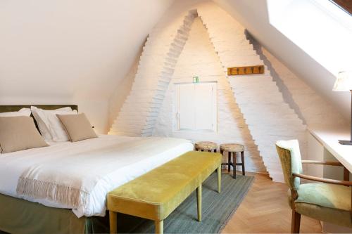Un pat sau paturi într-o cameră la B&B De Vrijboom