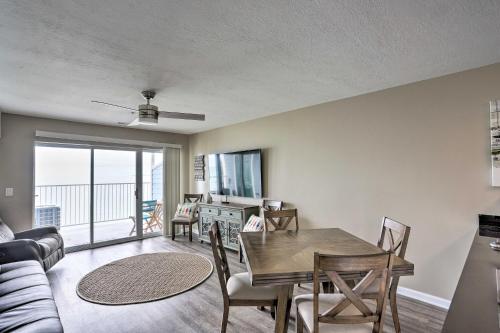 a living room with a dining room table with a view at Middle Bass Condo with Balcony, Lake Erie Views in Put-in-Bay
