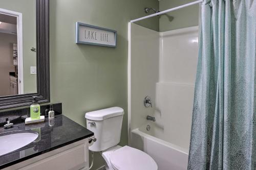 a bathroom with a toilet and a sink and a shower at Middle Bass Condo with Balcony, Lake Erie Views in Put-in-Bay