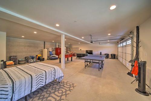 a garage with a ping pong table in it at River Acres Retreat with Grill and River Access! in Weaverville