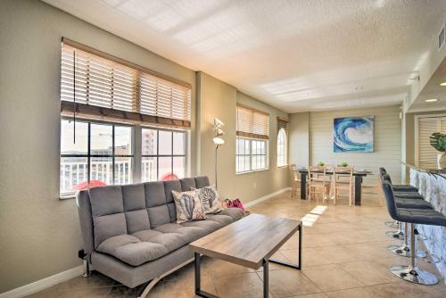 a living room with a couch and a table at Coastal Clearwater Condo Half Mile to Beach! in Clearwater Beach