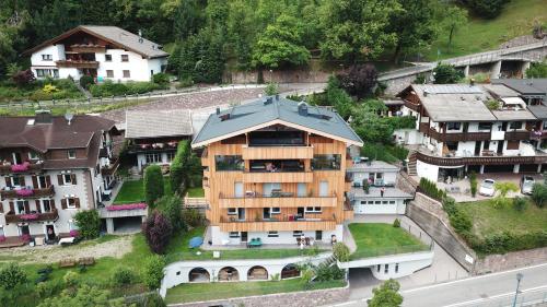 an aerial view of a house in a village at Villa Hubertus in Ortisei