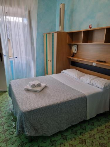 Ein Bett oder Betten in einem Zimmer der Unterkunft Albergo Stella Di Mare