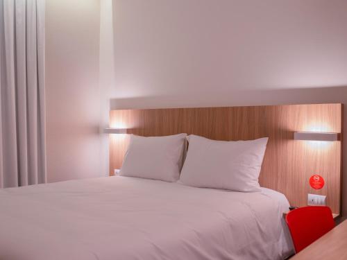 Cama o camas de una habitación en Hotel Moov Porto Alegre